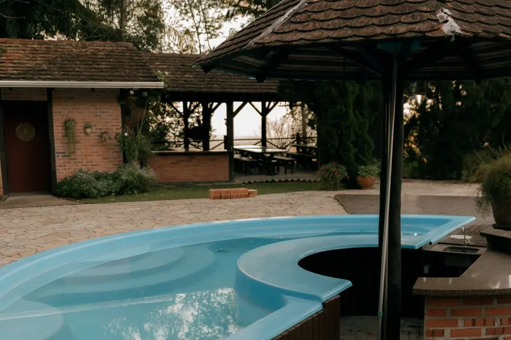 Freeform inground pool with gazebo and patio
