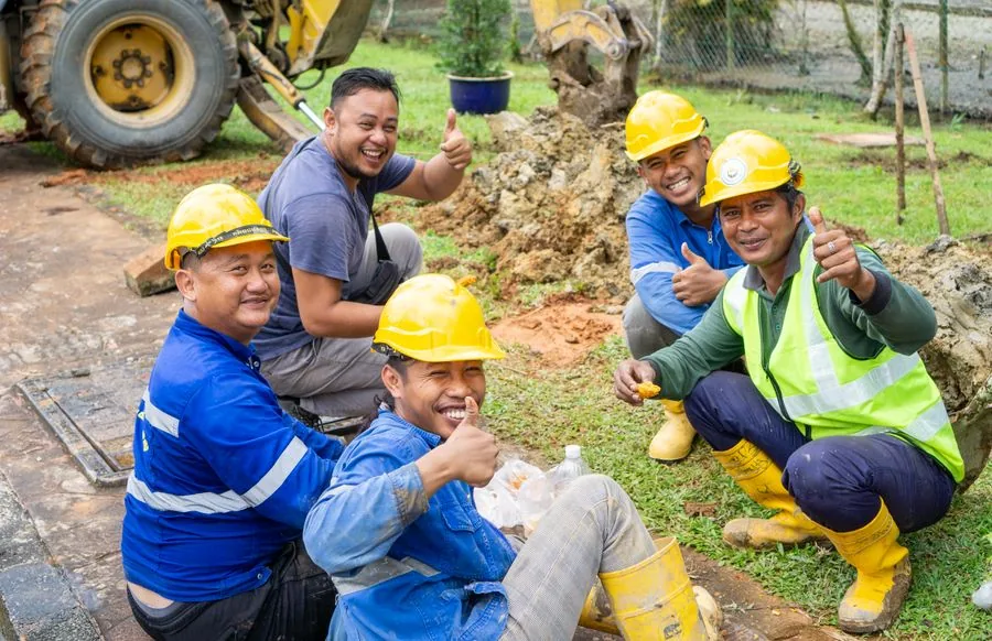 The [Your Company Name] design-build team on a job site