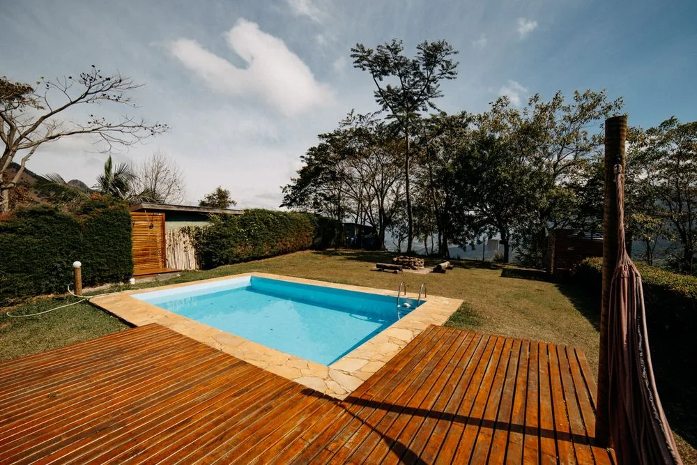 Pool with wood deck and fresh landscaping