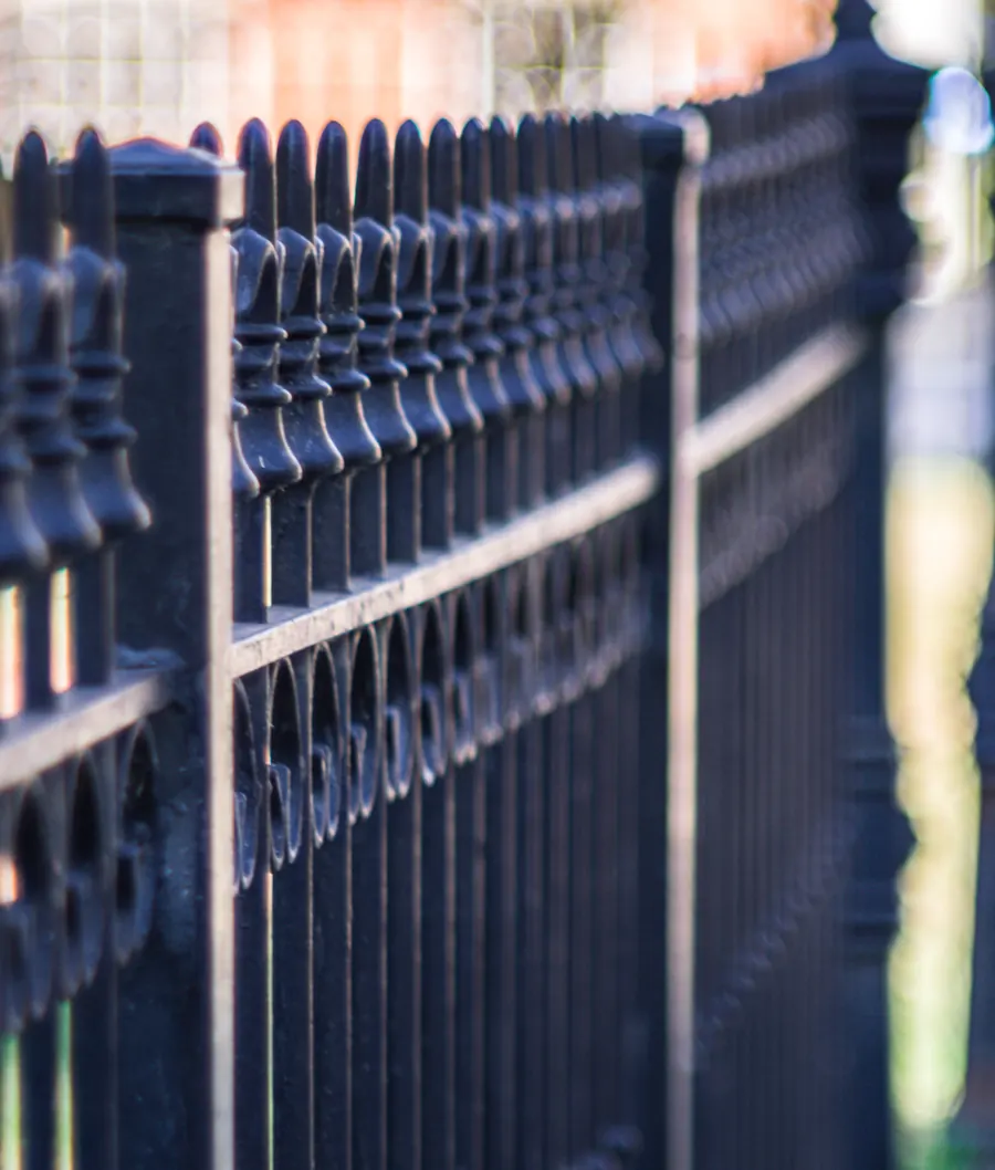 Detail of a wrought iron pool and yard fence